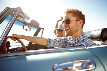 Image showing Car road trip, travel and fun happy couple on bonding holiday adventure, transportation journey or summer vacation. Love flare, convertible automobile driver and man and woman driving on Canada tour