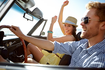 Image showing Car road trip, travel and happy couple laughing on holiday adventure, transportation journey or fun summer vacation. Love bond, convertible vehicle and male driver, man and woman driving in Canada