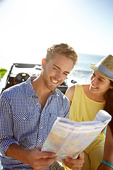 Image showing Adventure, road trip and couple with map by car on summer holiday, vacation and weekend getaway by ocean. Travelling, freedom and man and woman reading paper for directions, navigation and journey