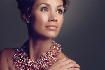 Image showing Rich woman, elegant and necklace jewelry isolated on a dark background in a studio, thinking of vintage beauty, ideas and a mature female model with vision for classic cosmetics and makeup