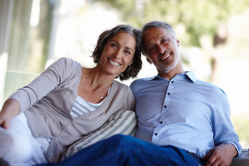 Image showing Portrait, love and senior couple on a couch, romance and relationship with happiness, home and retirement. Face, mature man and old woman on a sofa, romantic and marriage with bonding and loving