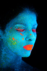 Image showing Neon paint, face makeup and woman closeup with dark background and creative cosmetics. Glow, fantasy and psychedelic cosmetic of a female model with unique and creativity with art in studio