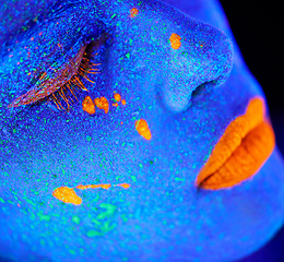 Image showing Neon paint, makeup zoom and woman face with black background and creative cosmetics. Glow beauty, fantasy and psychedelic cosmetic of a female model with unique and creativity with art in studio