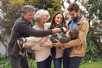 Image showing Happy family, child and grandparents playing with parents in a park on outdoor vacation, holiday and excited together. Backyard, happiness and people play with kid as love, care and bonding in nature