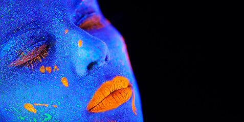 Image showing Neon paint, unique makeup and woman face closeup with dark background and creative cosmetics. Glow, fantasy and psychedelic cosmetic of a female model with mockup and creativity with art in studio