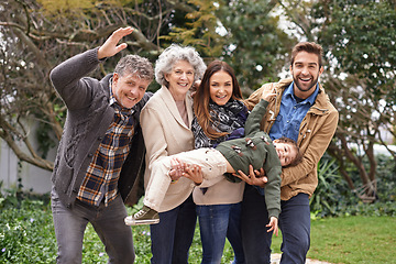 Image showing Family, happy and portrait of parents with kid in a park on outdoor vacation, holiday and excited together. Grandparents, happiness and people play with kid as love, care and bonding in a backyard