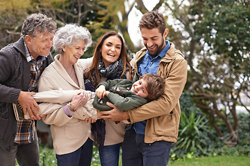 Image showing Family, child and grandparents or parents playing with kid in a park on outdoor vacation, holiday and excited together. Backyard, happiness and people play as love, care and bonding in nature