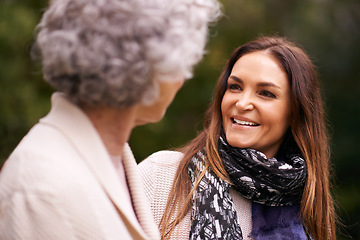 Image showing Smile, grandmother and woman with elderly parent together on a outdoor vacation or holiday bonding in happiness. Retirement, women and young happy female person in conversation and laughing with mom