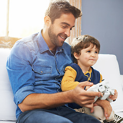 Image showing Love, father and son with video game, happiness and gaming at home, loving or smile. Family, male parent or dad with a kid, boy or child with technology, bonding or quality time with games or playing