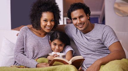 Image showing Family, child and reading book portrait in a home for story time on a lounge sofa with a smile. A woman, man or parents and girl child together for development, learning and love with a fantasy