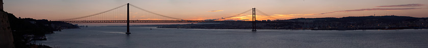 Image showing Panorama of bridge 25 de Abril on river Tagus at sunset, Lisbon, Portugal