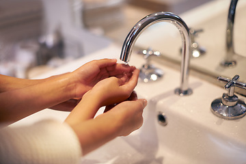 Image showing Closeup, washing hands and mother with child in a bathroom for learning, hygiene and cleaning. Basin, wash and hand protection by mom and girl together for prevention of bacteria, dirt and germs