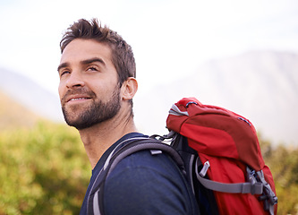 Image showing Hiking, happy and relax with man on mountain for fitness, adventure and travel journey. Backpack, summer and workout with male hiker trekking in nature path for training, freedom and explore