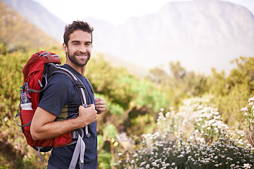 Image showing Hiking, happy and portrait of man on mountain for fitness, adventure and travel journey. Backpacking, summer and workout with male hiker trekking in nature path for training, freedom and explore