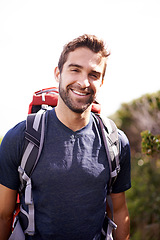 Image showing Hiking, travel and portrait of man on mountain for fitness, adventure and journey. Backpack, summer and face of with male hiker trekking in nature path for training, freedom and explore