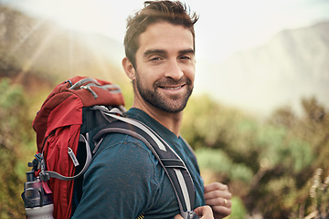 Image showing Hiking, adventure and portrait of man on mountain for fitness, relax and travel journey. Backpack, summer and workout with male hiker trekking in nature path for training, freedom and explore