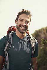 Image showing Hiking, smile and portrait of man on mountain for fitness, adventure and travel journey. Backpack, summer and workout with face of male hiker trekking in nature path for training, freedom and explore