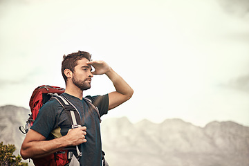 Image showing Trekking, mountain and man on an adventure thinking after exercise, workout and fitness in nature for wellness. Travel, vacation and young male person on a break in mockup space, training and hiking