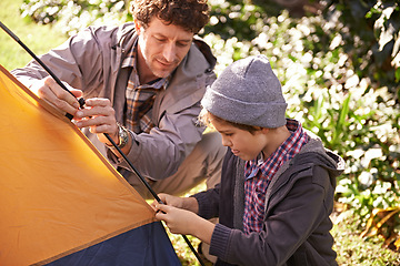 Image showing Dad, kid and set up tent for camping outdoor in nature on vacation while bonding in summer. Father, boy and preparing campsite, learning and helping in forest for travel, education and holiday.