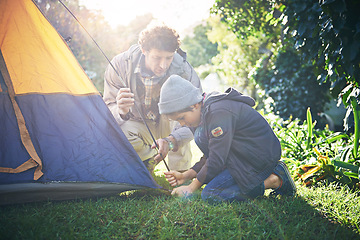 Image showing Father, kid and preparing tent for camping outdoor in nature on vacation while bonding in summer sunset. Dad, boy and setting up camp, learning and getting campsite ready in forest for holiday travel