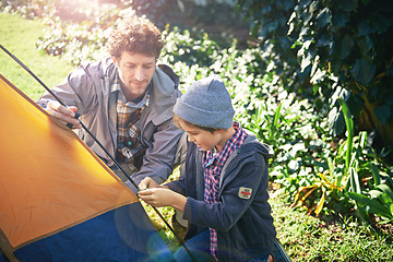 Image showing Father, kid and set up tent for camping outdoor in nature on vacation while bonding in summer. Dad, boy and preparing campsite, learning and getting ready in forest for travel, education and holiday.