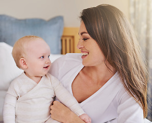 Image showing Mother, baby and smiling together or embracing daughter and having fun in the bedroom feeling happy. Parent, kid and mom bonding or carefree and excited together in the house or parenthood