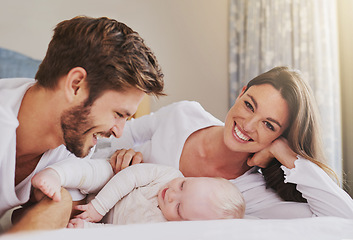 Image showing Portrait of happy mother, father and baby in bedroom for love, care and quality time to relax together in house. Mom, dad and smile with cute infant kid for happiness, support and newborn development