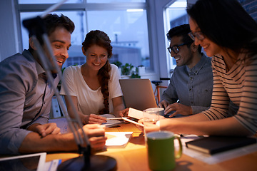 Image showing Teamwork, night and business colleagues working in the boardroom for planning, strategy or innovation. Meeting, collaboration and overtime with a team or group of employees at work in the evening