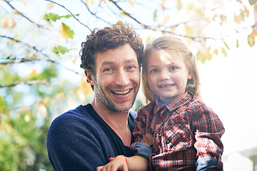 Image showing Happy, portrait and father with daughter in backyard garden for hugging, bonding or affectionate. Happiness, relax and excited with man and young girl in outdoors for embrace, autumn and care