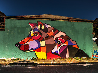 Image showing City street art, wolf graffiti and design tag with creativity outdoor in neighborhood. Urban wall mural, animal graphic and illustration with creative painting and artwork on building architecture