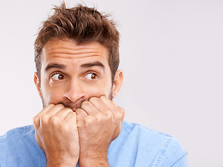 Image showing Portrait, bite nails and man with anxiety, mental health or depression with guy isolated on white studio background. Face, male person or model with bad habit, mockup or anxious with problem or issue