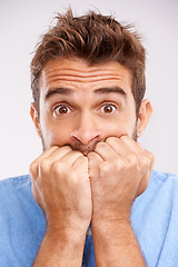 Image showing Bite nails, portait and man with stress, anxiety and worried person isolated on a white studio background. Face, male model or guy with mental health issue, problem and doubt with bad habit