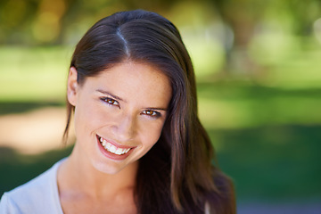 Image showing Face, happy and portrait of a woman in a park in summer for beauty, smile and confident in nature with happiness. Head, garden and female person or model outdoor with freedom, relax and in a forest