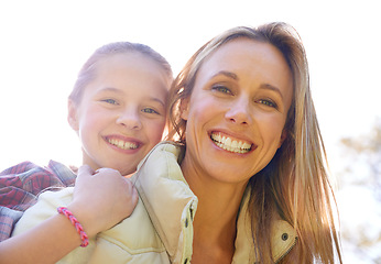 Image showing Face portrait, hug and happy mom, kid or people trekking, walking or hiking in nature, forest or outdoor woods. Mothers day, family and child smile, bonding and together with mother on piggyback ride