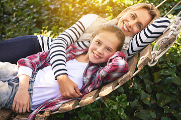 Image showing Portrait, hammock and relax happy child, mother and family bonding, care and spending quality time together. Happiness, smile and Canada mom, kid or people enjoy Mothers Day in backyard nature garden