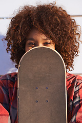 Image showing Hide, face and portrait of woman with skateboard for fitness, urban and hiding in outdoors. Training, skating and youth with african female skater and cover for hipster, relax and skateboarder afro