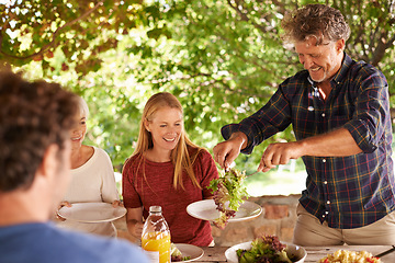 Image showing Food, party and happy with family at lunch and serving for health, bonding and celebration. Thanksgiving, social and event with group of people eating together for dining, generations and wellness