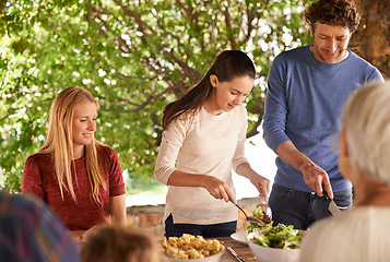 Image showing Food, party and lunch with family in nature and serving for health, bonding and celebration. Vacation, social and event with parents and children eating together for dining, generations and wellness