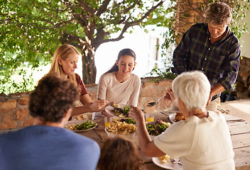 Image showing Food, party and eating with family at lunch in outdoor for happy, bonding and celebration. Vacation, social and event with parents and children share salad together for dining, generations and health