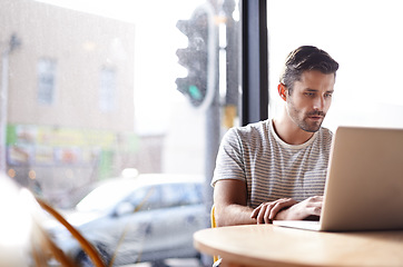 Image showing Coffee shop, web connection and man with laptop and lens flare doing code work in a cafe. Tech, email and male freelancer customer at restaurant with online job and computer writing with focus