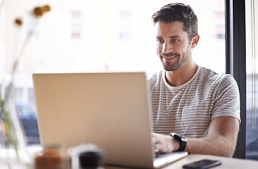 Image showing Employee, typing and man with a laptop, cafe and research for a new project, information and review. Male entrepreneur, happy guy or freelancer with technology, pc and search website in a coffee shop