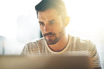 Image showing Entrepreneur, laptop or serious man in cafe reading news online the stock market for trading report update. Coffee shop, remote work or focused trader typing an email or networking on digital website