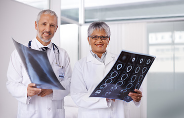 Image showing Senior team of doctors in portrait with xray, people in radiology with healthcare and medical collaboration. Anatomy scan for surgery, old man and woman surgeon with smile, happy working together