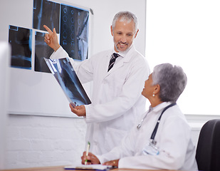 Image showing Senior team of doctors, study xray for surgery and people in radiology with healthcare in clinic. Review anatomy scan, old man and woman surgeon collaboration with assessment and problem solving