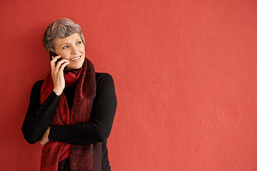 Image showing Mature woman, phone call and smile by wall with space for mockup, communication and listen by red background. Senior lady, smartphone and think of idea in mock up for chat, networking and talking