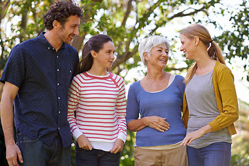 Image showing Family, parents with child and grandmother outdoor, happiness and freedom in nature park together. Love, trust and support with happy people spending quality time outside with care and generations