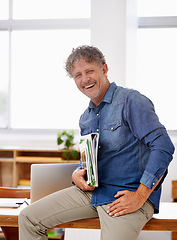 Image showing Portrait, mature and business man laughing in office while holding tablet and paperwork. Entrepreneur, professional and male executive from Canada sitting on desk and laugh at funny joke or comedy.