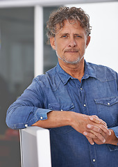 Image showing Portrait, mature and business man in office with pride for career at startup. Entrepreneur, professional and male manager, confident boss and serious person from Australia leaning on computer.