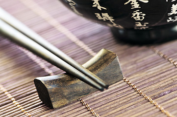 Image showing Rice bowl and chopsticks