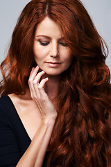 Image showing Hair care, red head and woman in studio for beauty, wellness and keratin treatment on white background. Haircare salon, hairdresser and ginger female model with shine, healthy and natural hairstyle